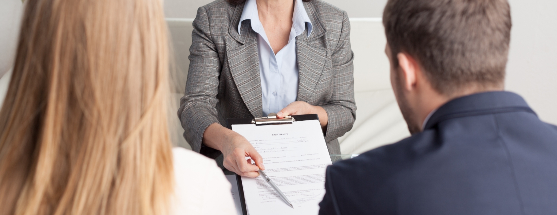 A solicitor showing a couple their financial settlement