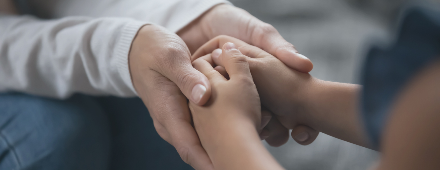 custody-of-children-image-1 Close up of mother holding child's hands