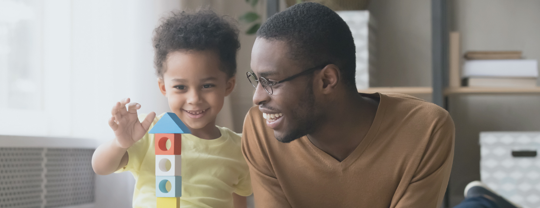 Father and son playing with blocks