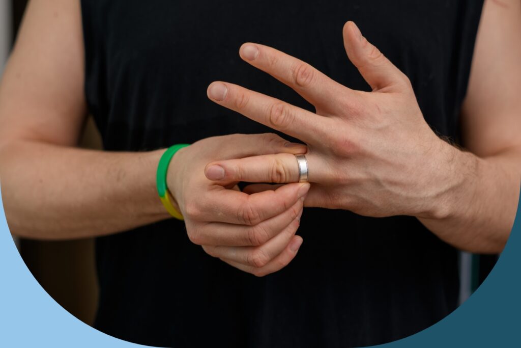 A man removing his wedding ring